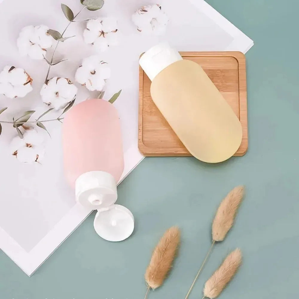 Empty bottles packaged in soft silicone squeeze tubes, refillable water bottles, available for bulk purchase